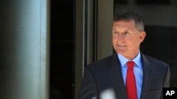 Former Trump national security adviser Michael Flynn leaves federal courthouse in Washington, July 10, 2018, following a status hearing.