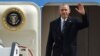 U.S. President Barack Obama waves as he leaves the plane upon his arrival at the airport in Hannover, northern Germany, April 24, 2016. Obama is on a two-day official visit to Germany. 